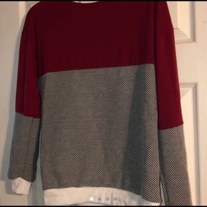 Maroon, black, and white sweater.